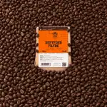 Greenwich Coffee'nin kahve çekirdekleri ve filtre paketi detayları.